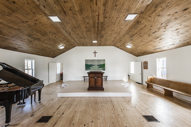 misc room with bar, lofted ceiling, wooden ceiling, and light hardwood / wood-style floors