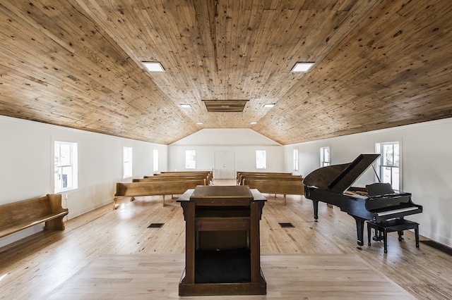 interior space with vaulted ceiling, wooden ceiling, and light hardwood / wood-style floors