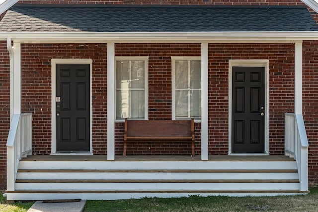 entrance to property featuring covered porch