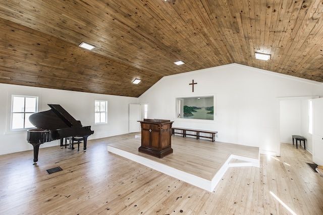 interior space featuring vaulted ceiling, wooden ceiling, light hardwood / wood-style floors, and plenty of natural light