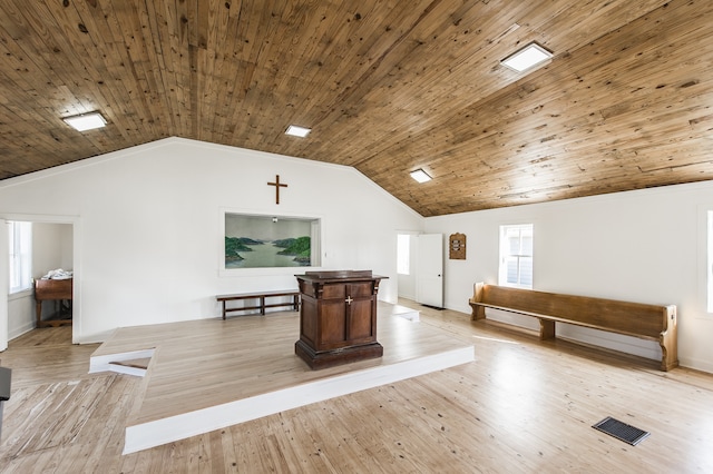 additional living space featuring wood ceiling, vaulted ceiling, and light hardwood / wood-style floors