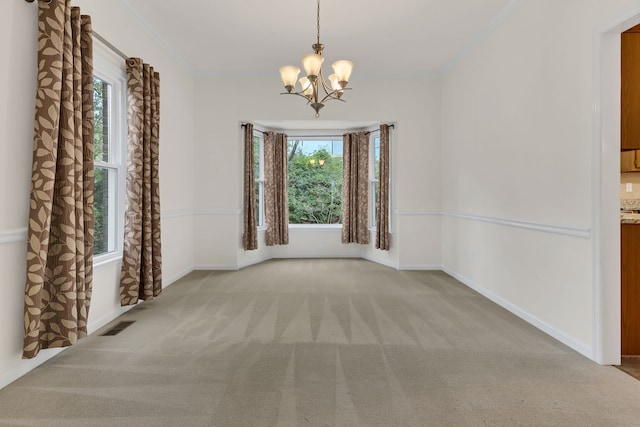 spare room featuring light carpet, a wealth of natural light, and crown molding