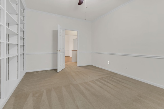 unfurnished bedroom with light colored carpet, ceiling fan, and ornamental molding