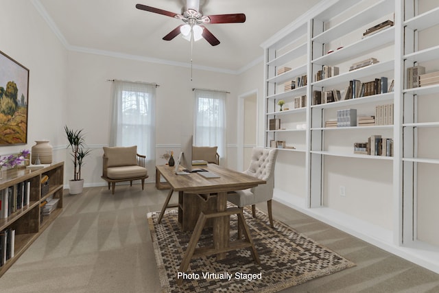 office featuring carpet floors, ceiling fan, and crown molding