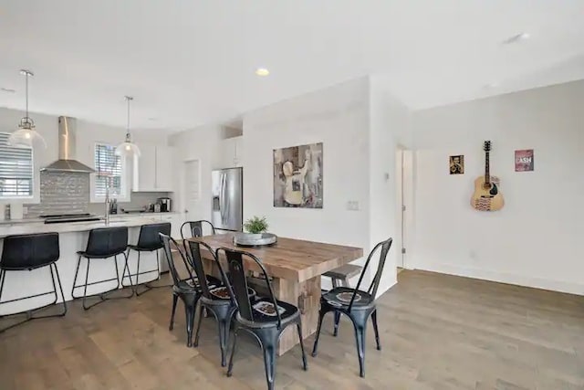 dining area with light hardwood / wood-style floors