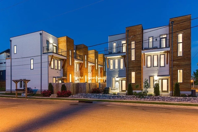 view of front of home featuring a balcony