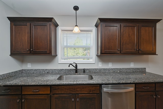 kitchen featuring dark brown cabinetry, dark stone countertops, sink, and dishwasher