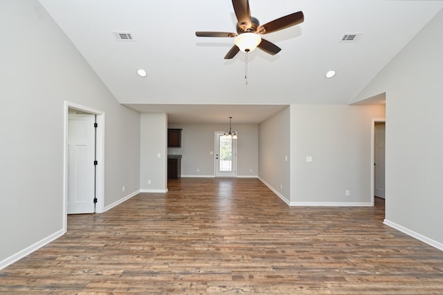 unfurnished living room featuring vaulted ceiling, hardwood / wood-style flooring, and ceiling fan