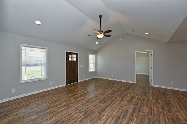 unfurnished living room featuring dark hardwood / wood-style flooring, lofted ceiling, and ceiling fan