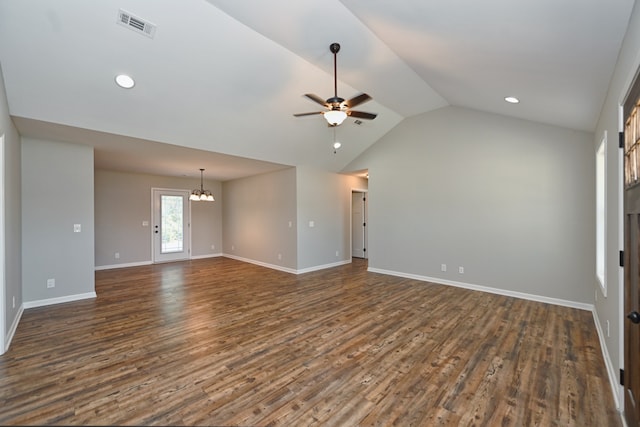 unfurnished living room featuring ceiling fan with notable chandelier, dark wood-type flooring, and lofted ceiling