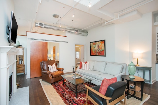 living room featuring dark wood-type flooring