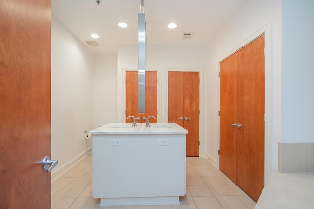 bathroom with vanity and tile patterned flooring