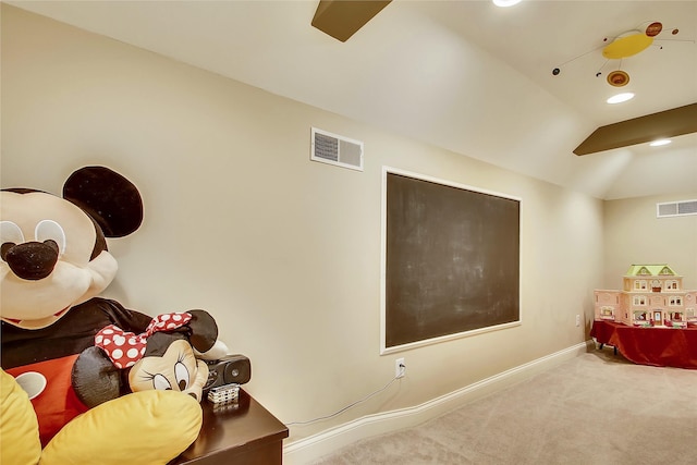 interior space with lofted ceiling and carpet floors