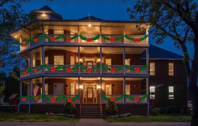 view of front of home featuring a balcony and a porch