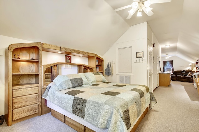 bedroom with vaulted ceiling, light carpet, and ceiling fan