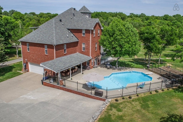 view of swimming pool with a lawn and a patio area