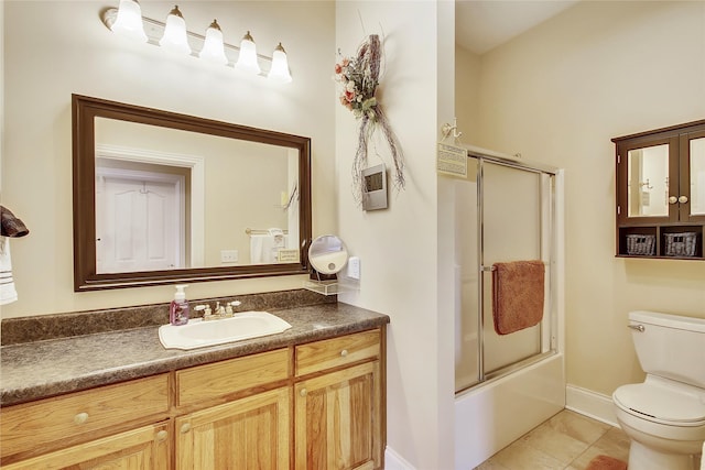 full bathroom featuring enclosed tub / shower combo, tile patterned flooring, vanity, and toilet