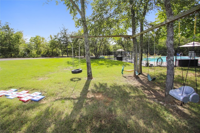 view of yard featuring a community pool