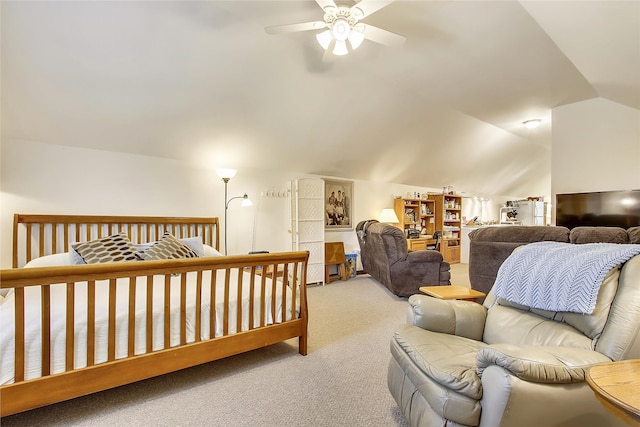 carpeted bedroom with ceiling fan and vaulted ceiling