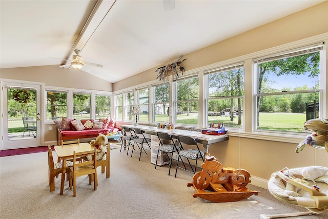 sunroom with ceiling fan and lofted ceiling