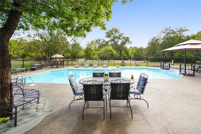 view of swimming pool featuring a patio