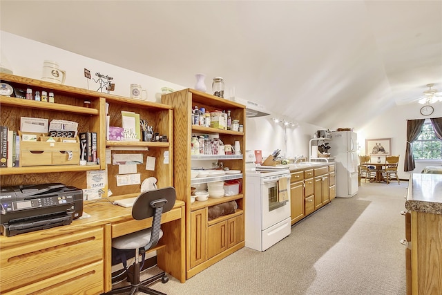 office space featuring sink, ceiling fan, light carpet, and lofted ceiling