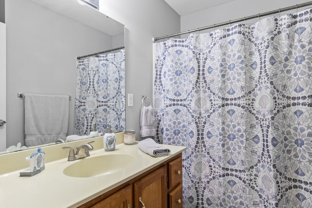 bathroom featuring vanity and a textured ceiling