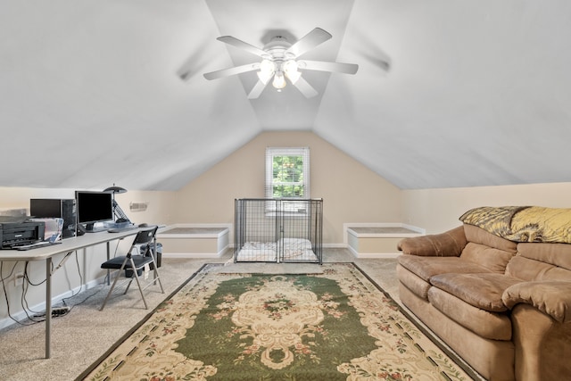 office area featuring ceiling fan, light colored carpet, and vaulted ceiling