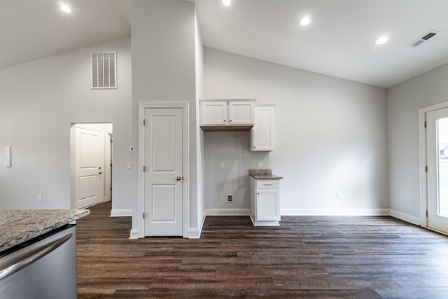 kitchen featuring dark wood-type flooring, white cabinetry, light stone counters, and dishwasher