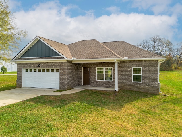 view of front facade featuring a front yard and a garage