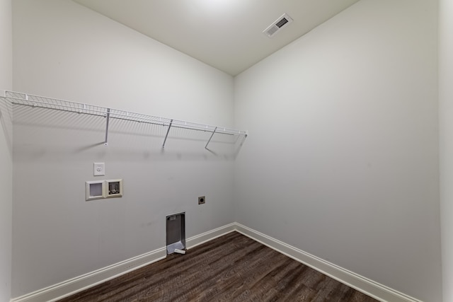 washroom featuring dark wood-type flooring, hookup for a washing machine, and electric dryer hookup