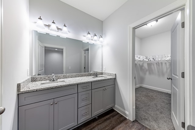 bathroom with vanity and hardwood / wood-style flooring