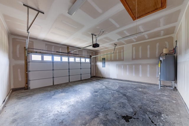 garage with a garage door opener, electric panel, and water heater