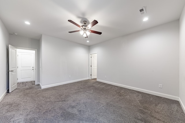 carpeted spare room featuring ceiling fan