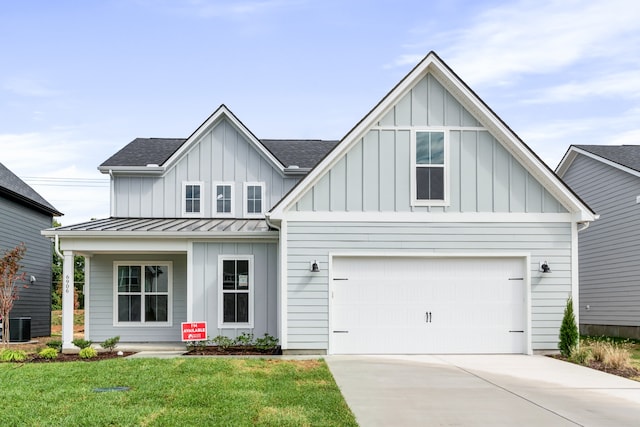 view of front facade with a garage and a front yard