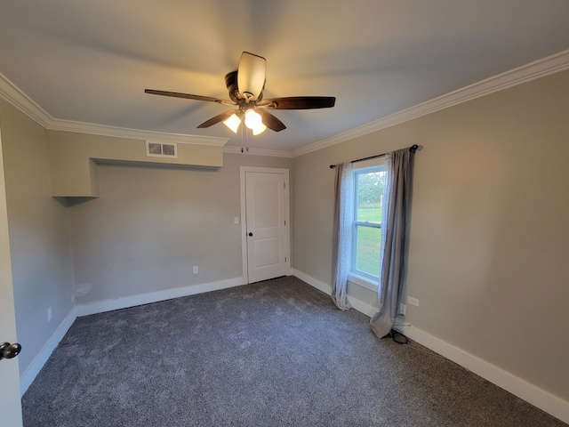 carpeted spare room featuring ornamental molding and ceiling fan