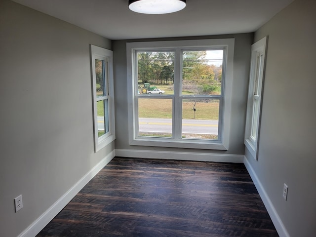 unfurnished room featuring dark hardwood / wood-style flooring