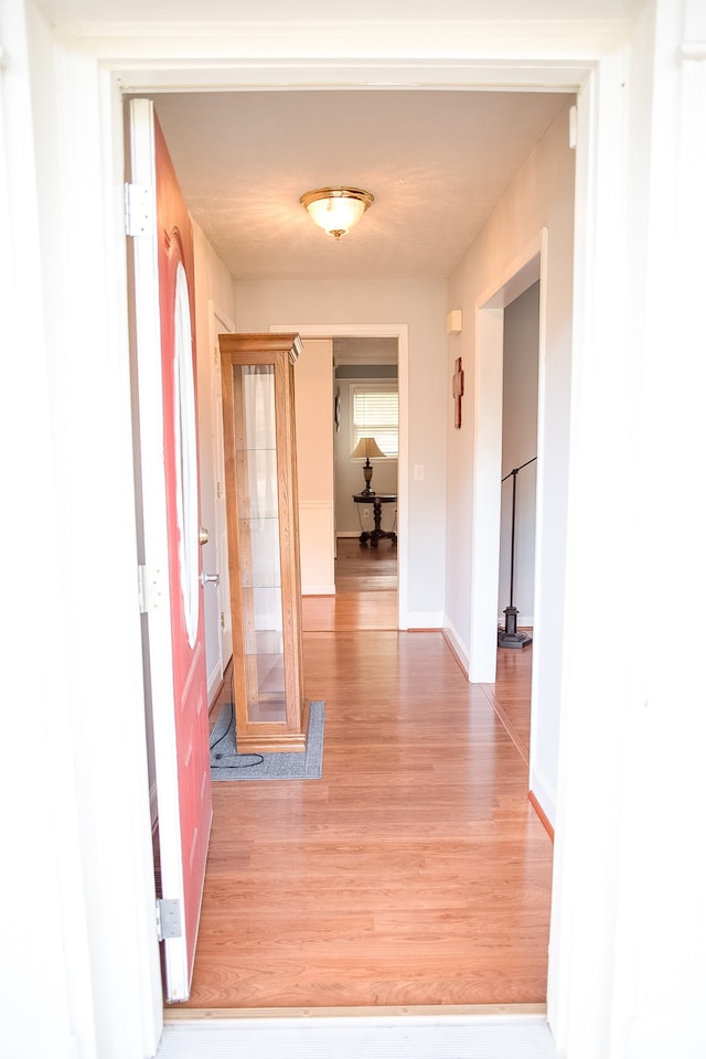 corridor featuring light wood-type flooring