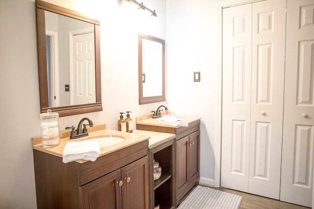 bathroom with wood-type flooring and vanity