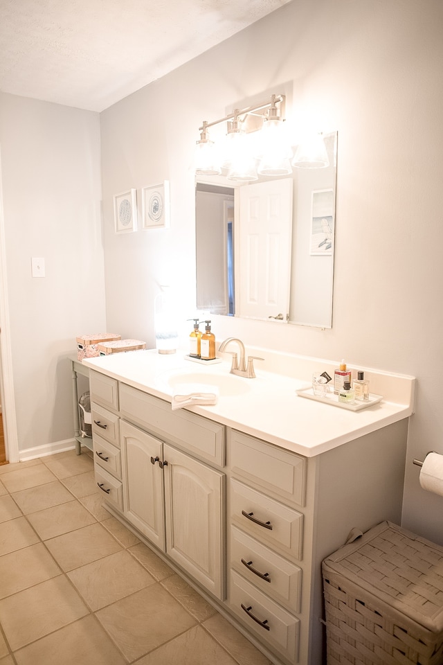 bathroom with tile patterned floors and vanity