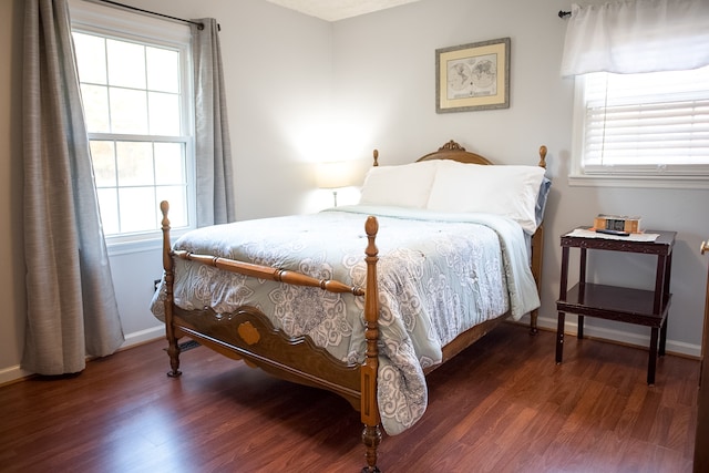 bedroom featuring dark hardwood / wood-style flooring