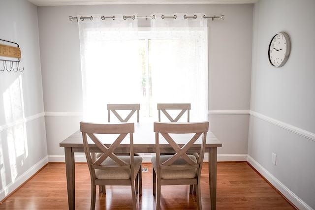 dining area with hardwood / wood-style floors