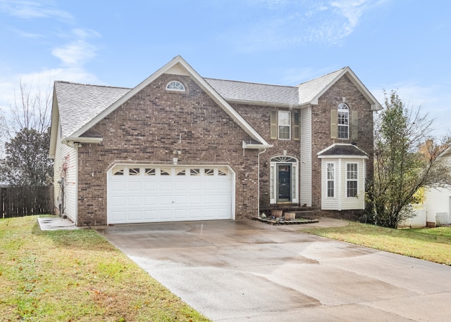 view of property featuring a front lawn