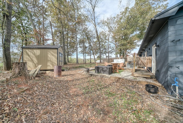 view of yard with central air condition unit and a storage shed