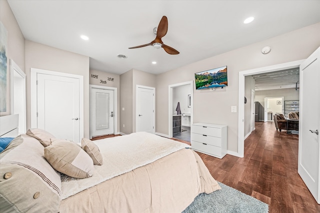 bedroom featuring dark wood-type flooring, ensuite bathroom, and ceiling fan