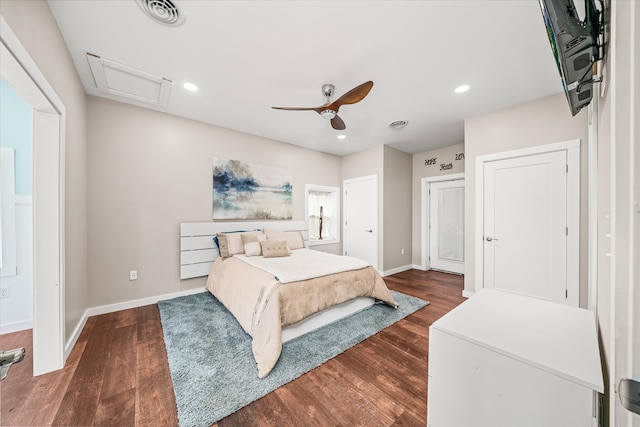 bedroom with ceiling fan and dark hardwood / wood-style flooring