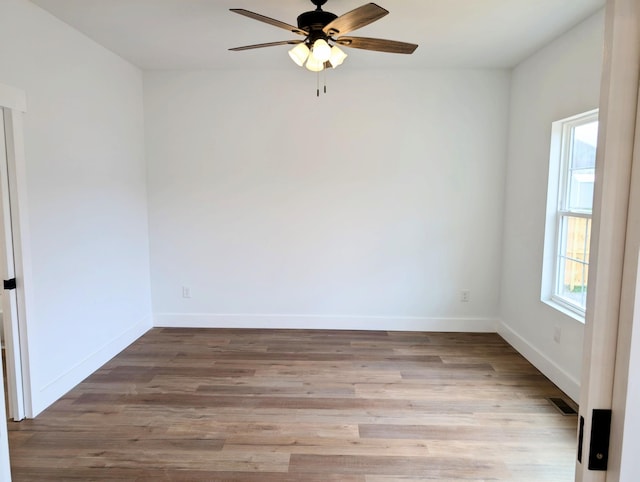 spare room featuring ceiling fan and light hardwood / wood-style floors