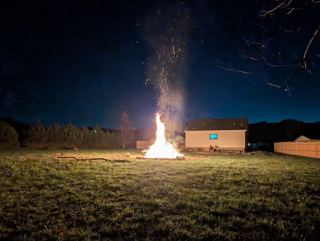 view of yard at twilight