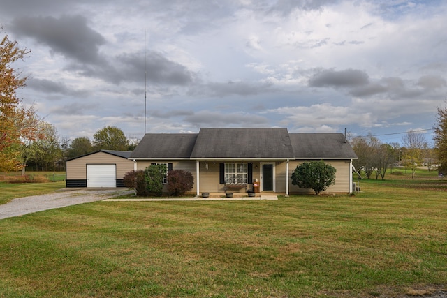 ranch-style home with covered porch, a garage, an outdoor structure, and a front lawn