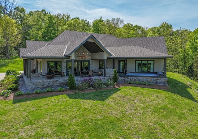 view of front facade featuring a front lawn and a patio area